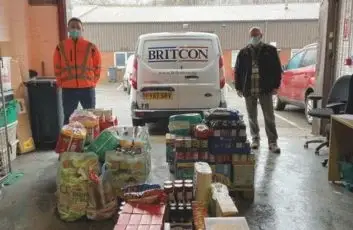 Team members presenting food and essential item donations to Chesterfield Foodbank as part of a collaborative community support initiative involving Britcon.