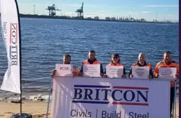 Britcon employees taking part in a community beach clean at South Gare, helping to remove litter and protect the local coastline.