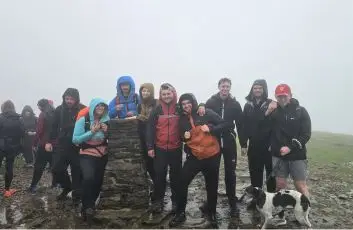 Britcon team members pose together after completing the Yorkshire Three Peaks Challenge and raising funds for the Britcon Foundation and local charities.
